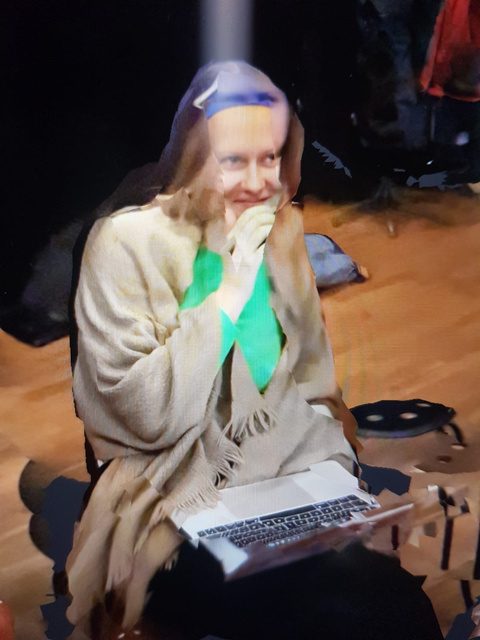 Participant laughing with a tablet